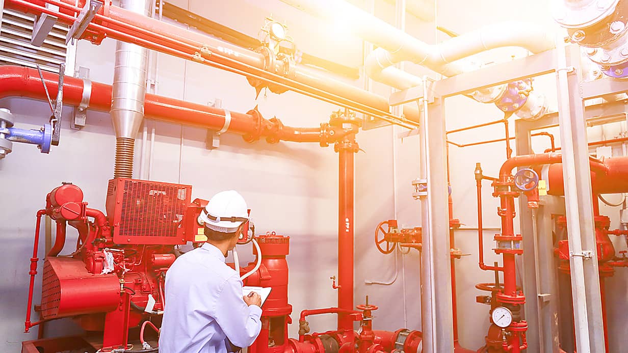 Engineer looking at pipes